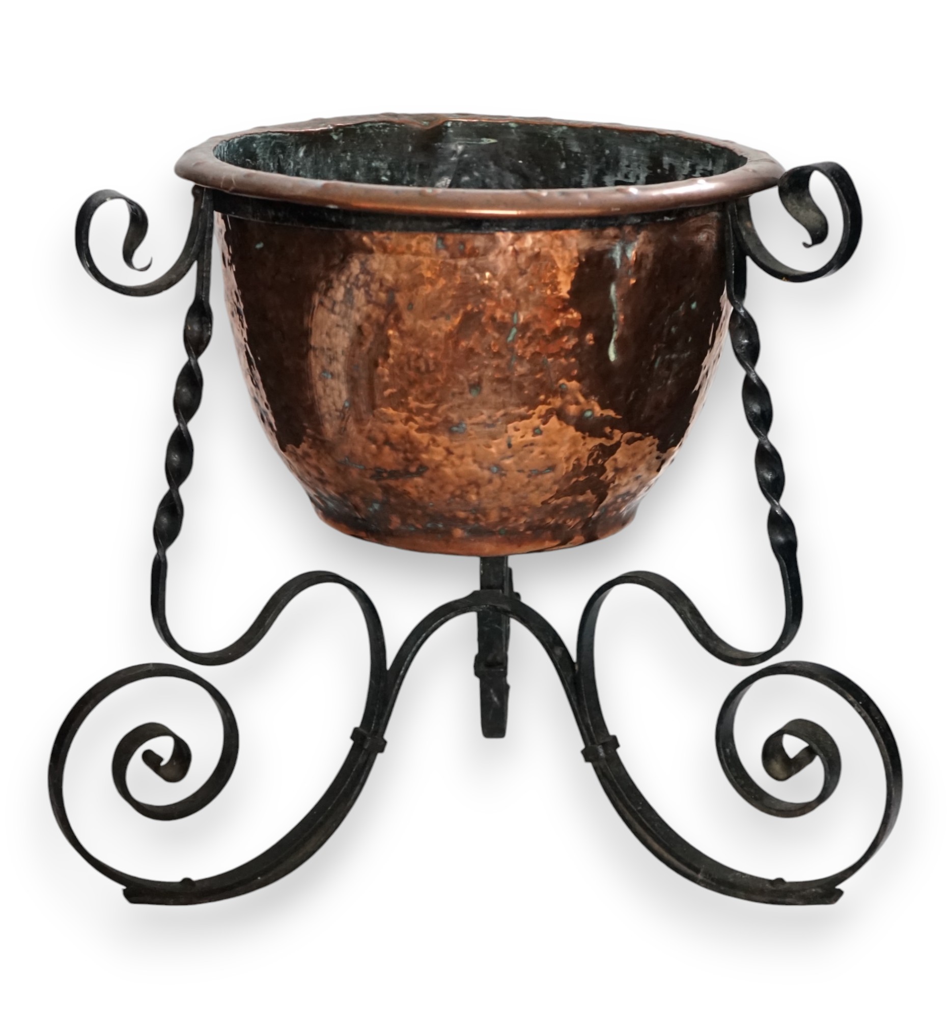 An Edwardian wrought iron and copper jardiniere